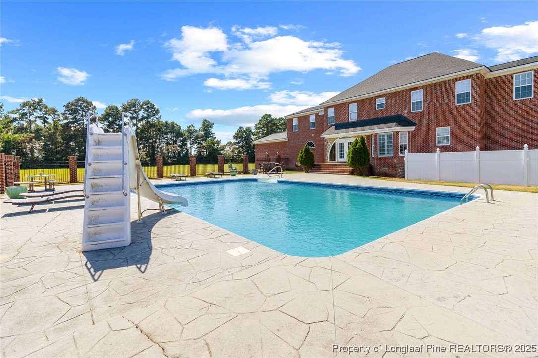 499 Price Road Fairmont, NC 28340 - Photo 41 of 50 a view of a house with swimming pool