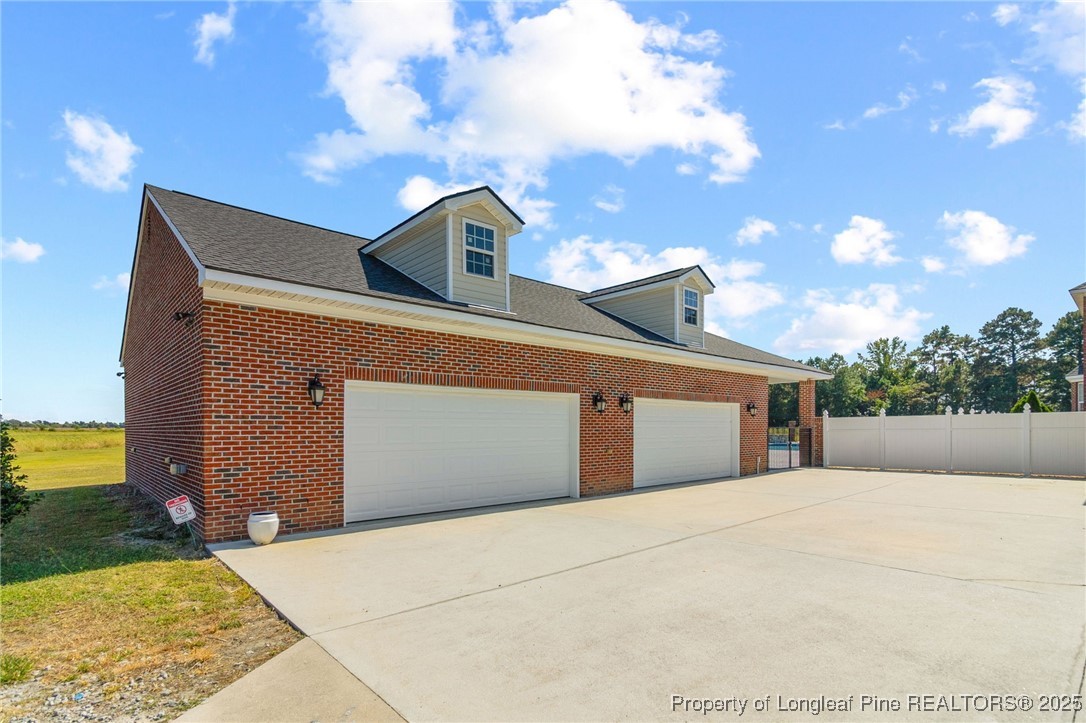 499 Price Road Fairmont, NC 28340 - Photo 42 of 50 a front view of a house with a yard and garage