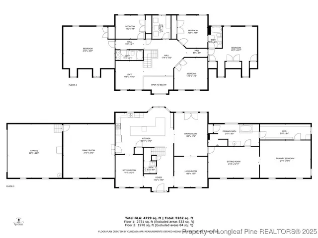 a view of a garden with wooden fence