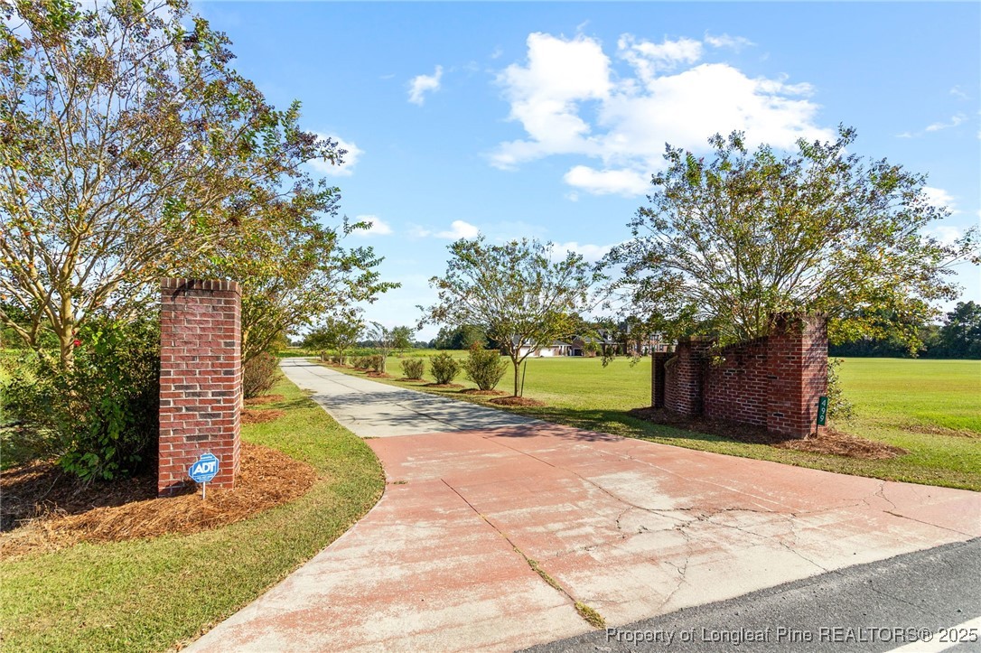 499 Price Road Fairmont, NC 28340 - Photo 49 of 50 a view of a garden with wooden fence