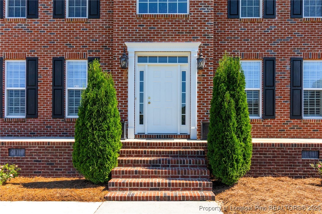 499 Price Road Fairmont, NC 28340 - Photo 5 of 50 a view of a brick house with plants and floor