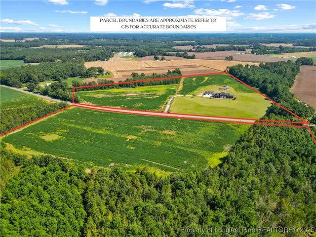 an aerial view of a houses with a yard