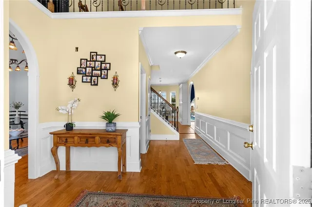a view of living room with furniture and wooden floor