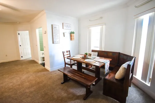 a view of a door and chair in the balcony