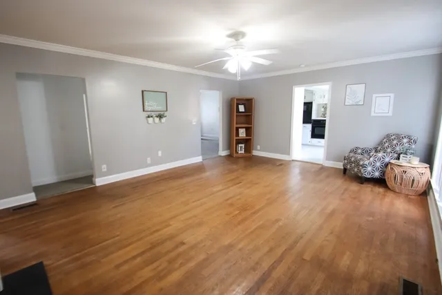 a view of a livingroom with wooden floor