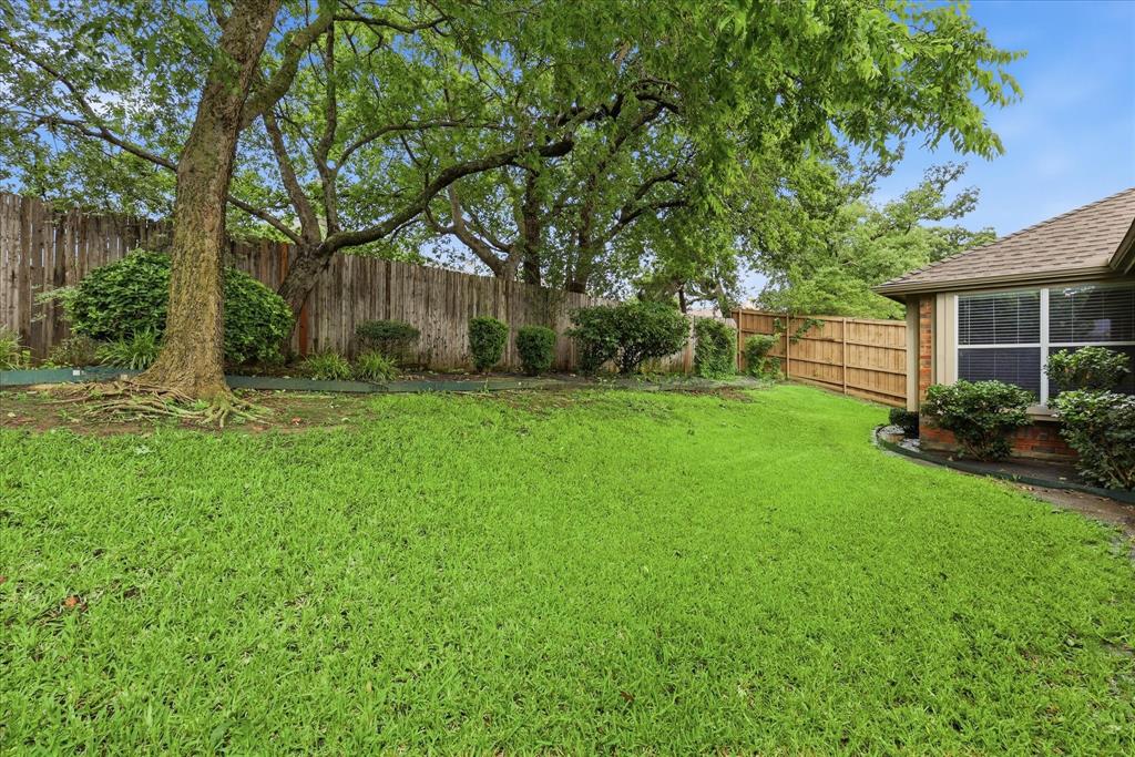 2616 Hollow Ridge Drive Denton, TX 76210 - Photo 30 of 31 Expansive green lawn with mature trees and perimeter fencing