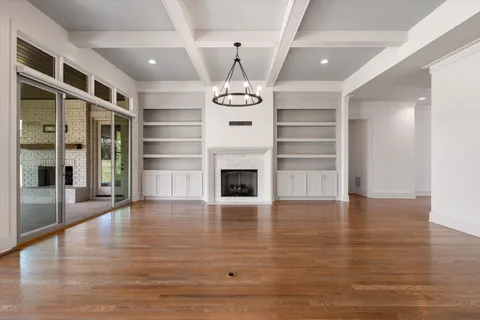 a kitchen with stainless steel appliances granite countertop a sink and a window