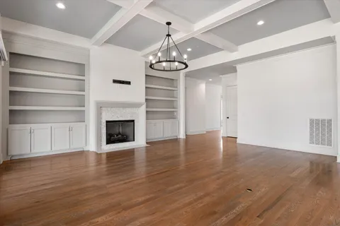 a kitchen with stainless steel appliances granite countertop a sink and a white cabinets