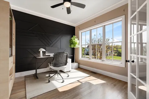 a bath tub sitting next to a window