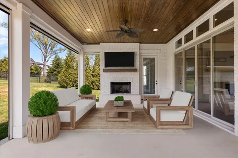 a view of a kitchen with granite countertop a stove top oven a sink and dishwasher with wooden floor