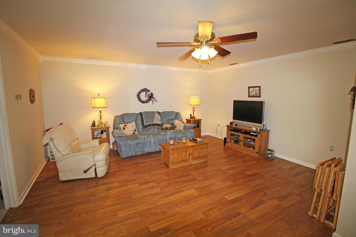 11920 Liberty Road, Unit 106B Frederick, MD 21701 - Photo 2 of 15 a living room with furniture and a flat screen tv