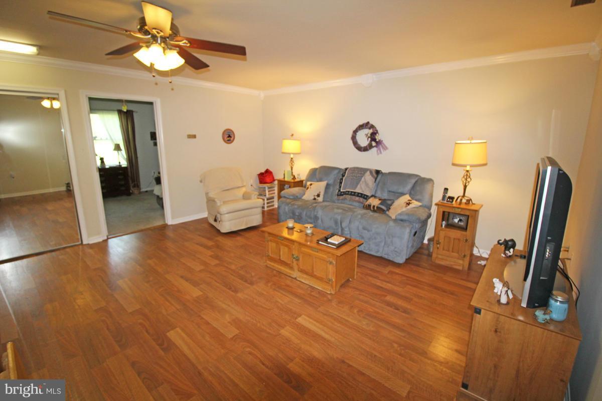 11920 Liberty Road, Unit 106B Frederick, MD 21701 - Photo 3 of 15 a living room with furniture and a flat screen tv