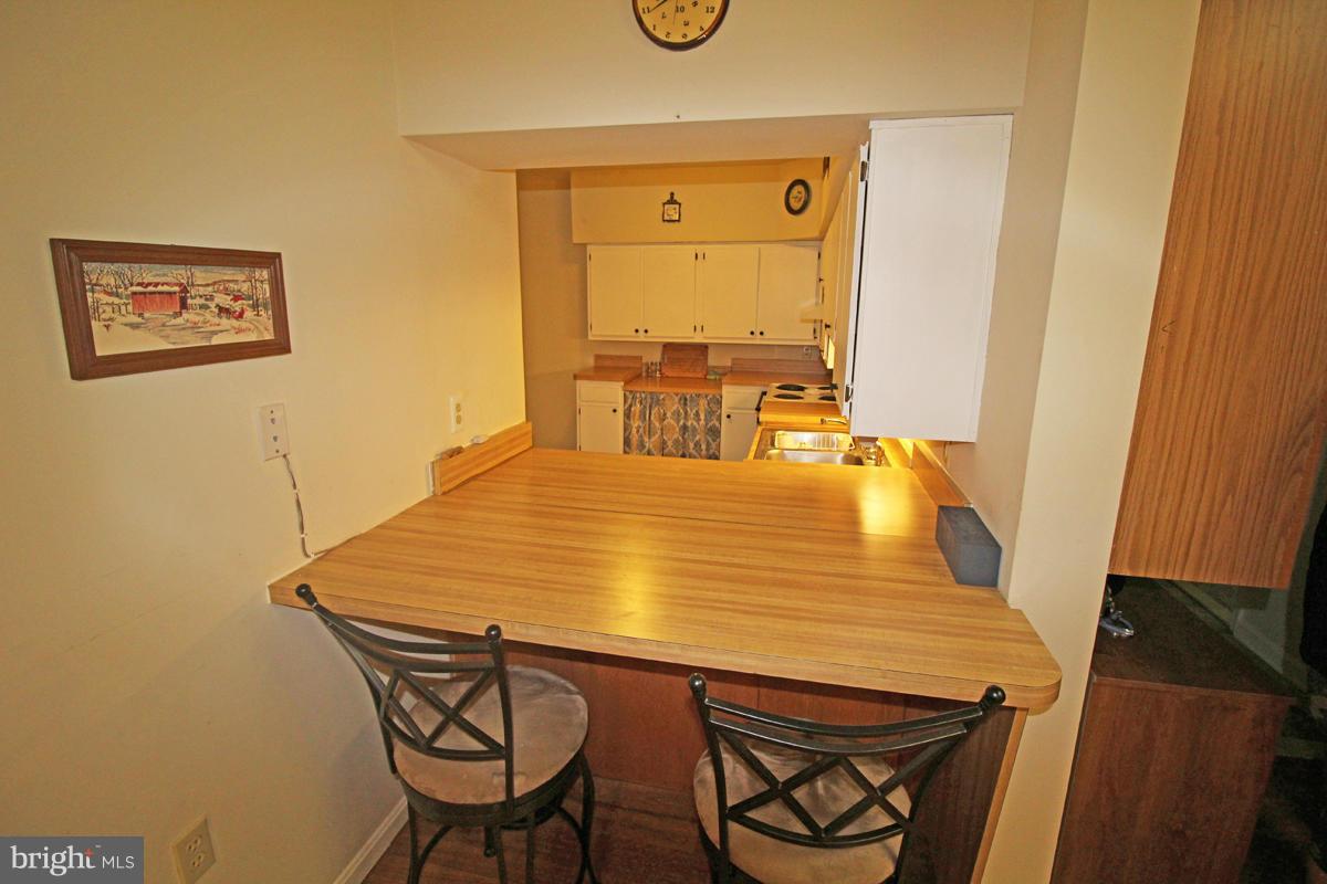11920 Liberty Road, Unit 106B Frederick, MD 21701 - Photo 8 of 15 a dining table with chairs and window