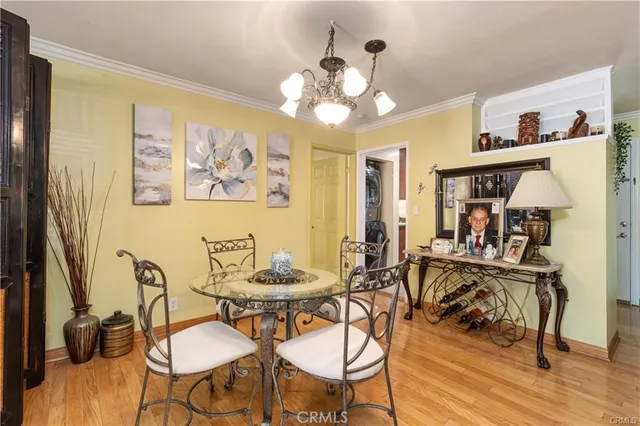 a living room with furniture a fireplace and a floor to ceiling window