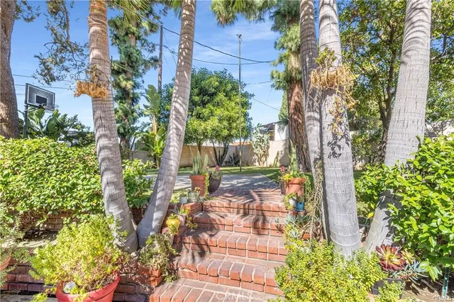 an outdoor space with patio and umbrella