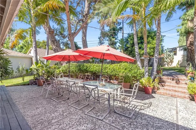 a kitchen with stainless steel appliances granite countertop a stove a sink dishwasher and a refrigerator