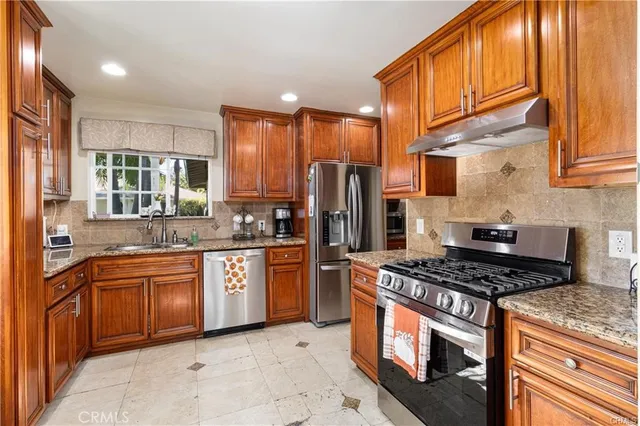 a dining room with furniture a chandelier and a window