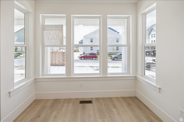 952 Mathilda Drive, Unit 156 Saratoga Springs, UT 84045 - Photo 19 of 25 Light wood-finish flooring complements the crisp white walls and extensive trim work