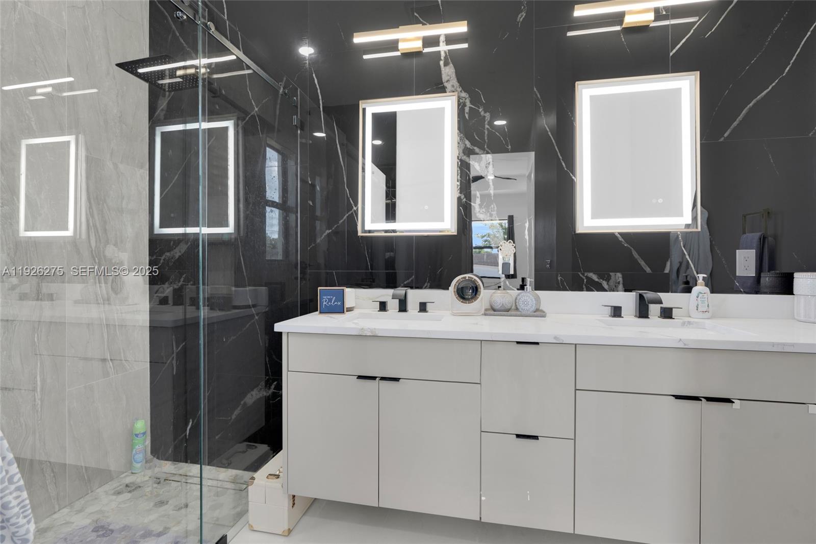 2250 10th Terrace Lehigh Acres, FL 33936 - Photo 13 of 39 a bathroom with a double vanity sink mirror and