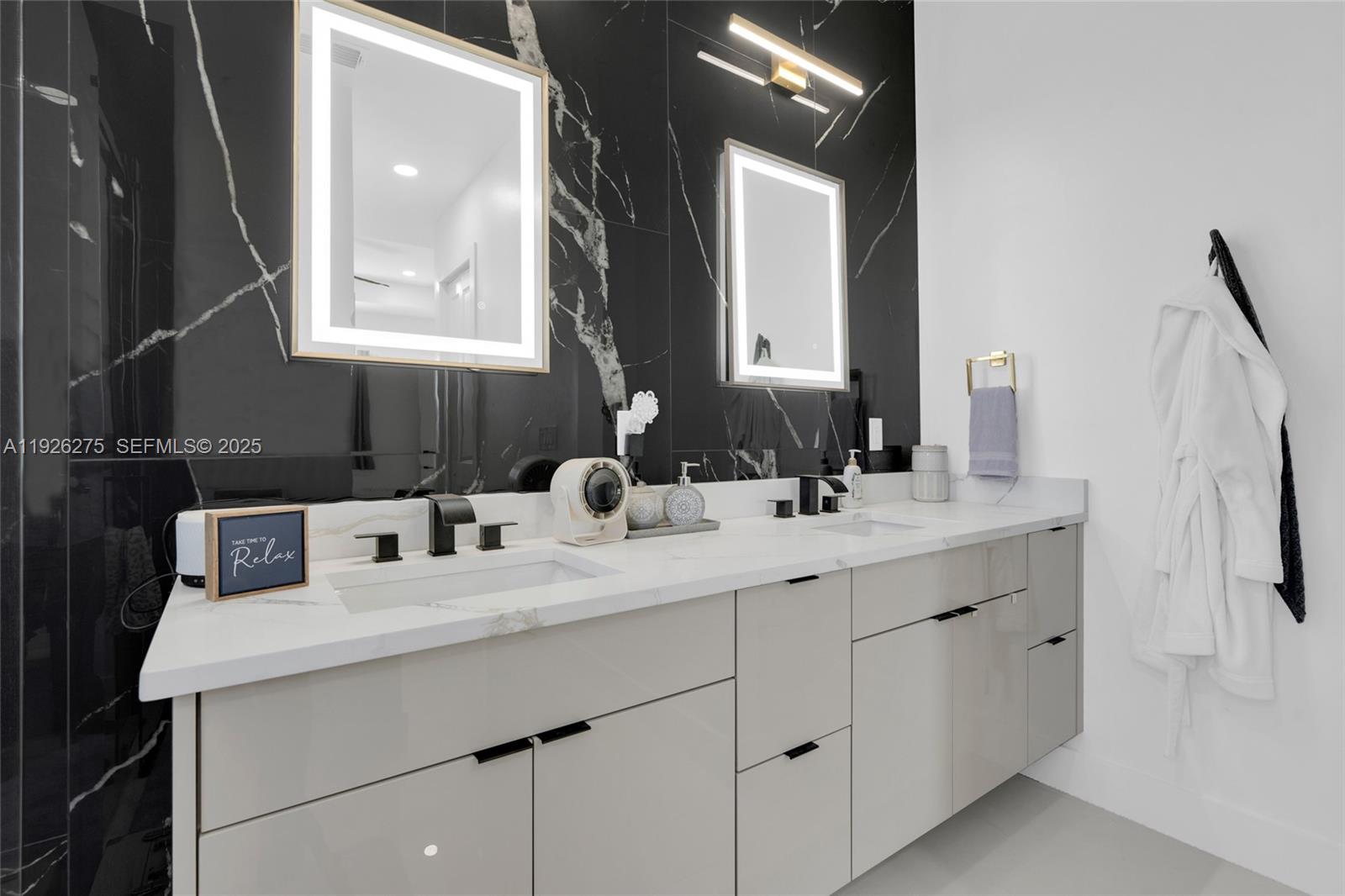 2250 10th Terrace Lehigh Acres, FL 33936 - Photo 15 of 39 a bathroom with a double vanity sink mirror and double