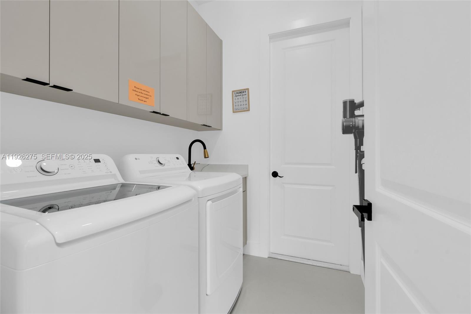 2250 10th Terrace Lehigh Acres, FL 33936 - Photo 19 of 39 a utility room with dryer and washer