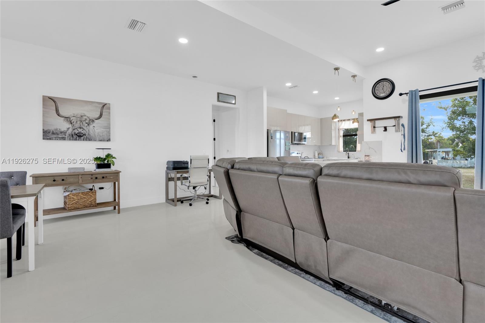 2250 10th Terrace Lehigh Acres, FL 33936 - Photo 27 of 39 a living room with furniture and a large window