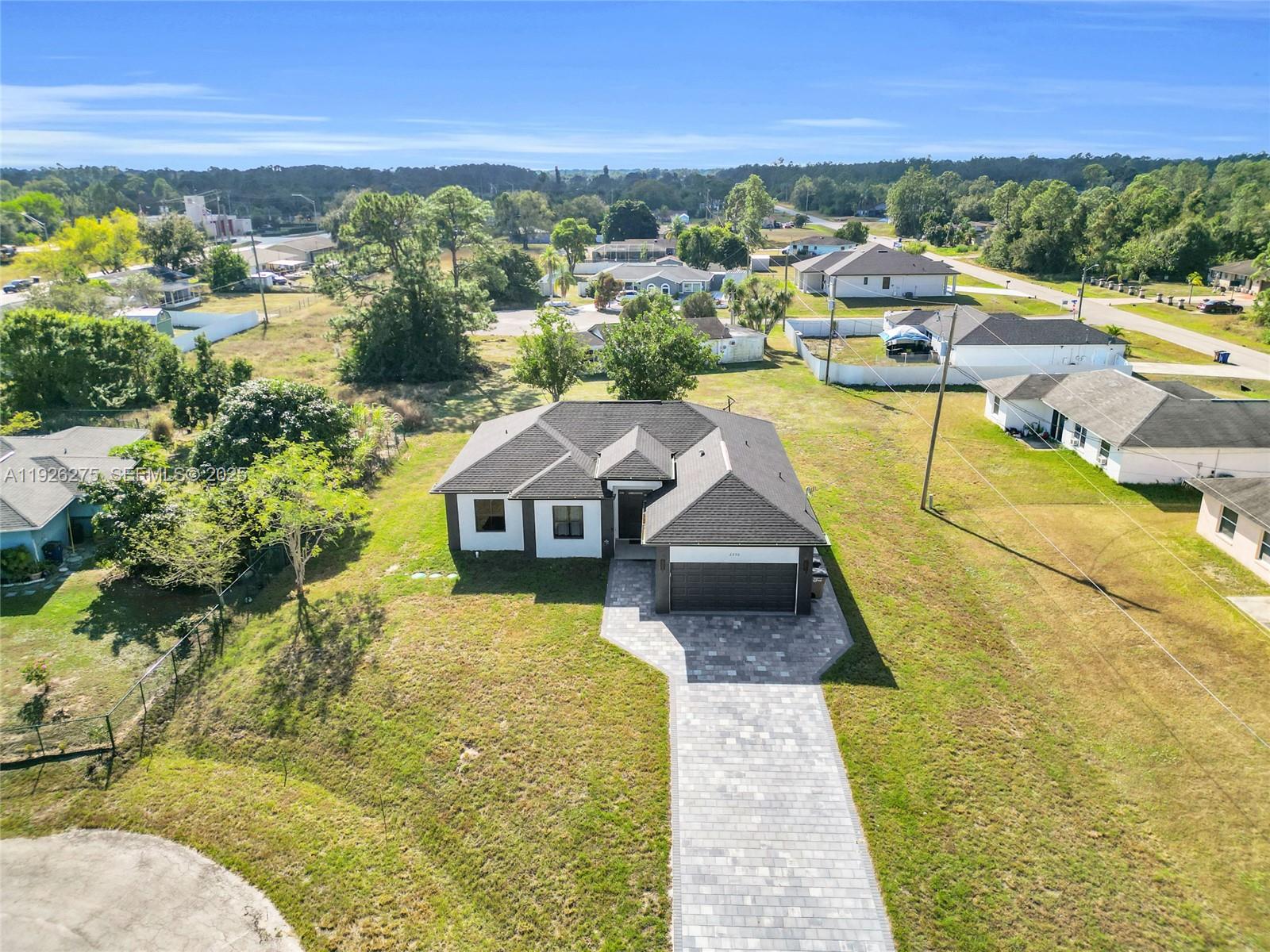 2250 10th Terrace Lehigh Acres, FL 33936 - Photo 6 of 39 a view of a swimming pool with a lake view