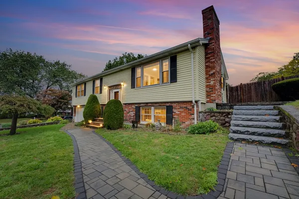 a front view of a house with a yard