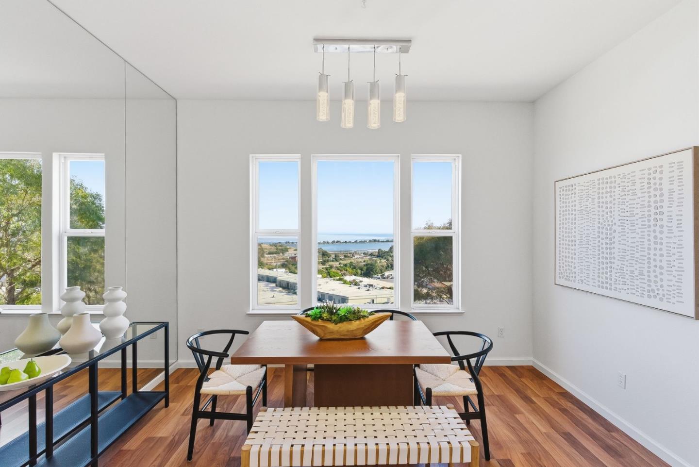 121 Cliff Swallow Court Brisbane, CA 94005 - Photo 11 of 50 a view of a dining room with furniture a chandelier and wooden floor
