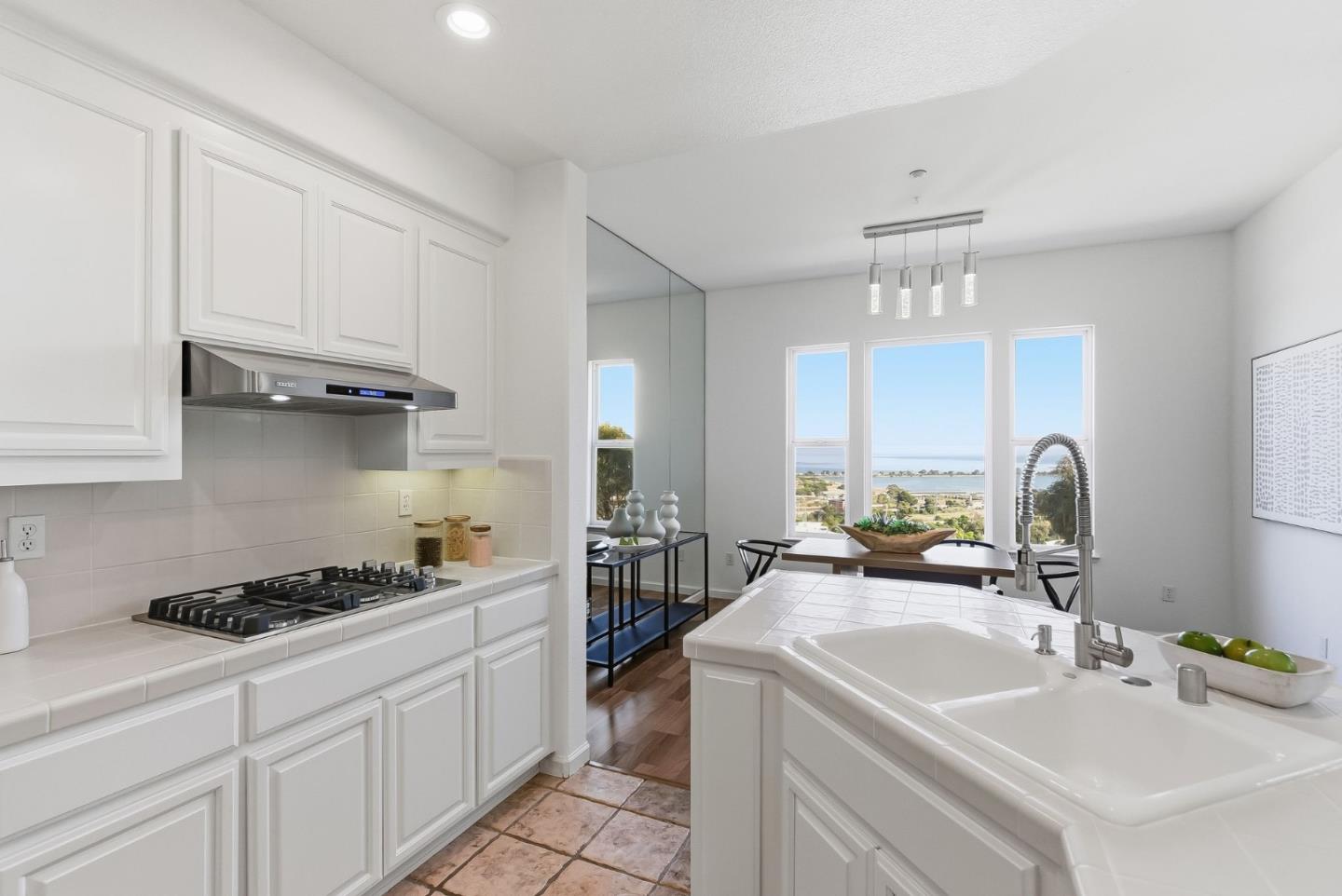121 Cliff Swallow Court Brisbane, CA 94005 - Photo 18 of 50 a kitchen with a sink cabinets and appliances
