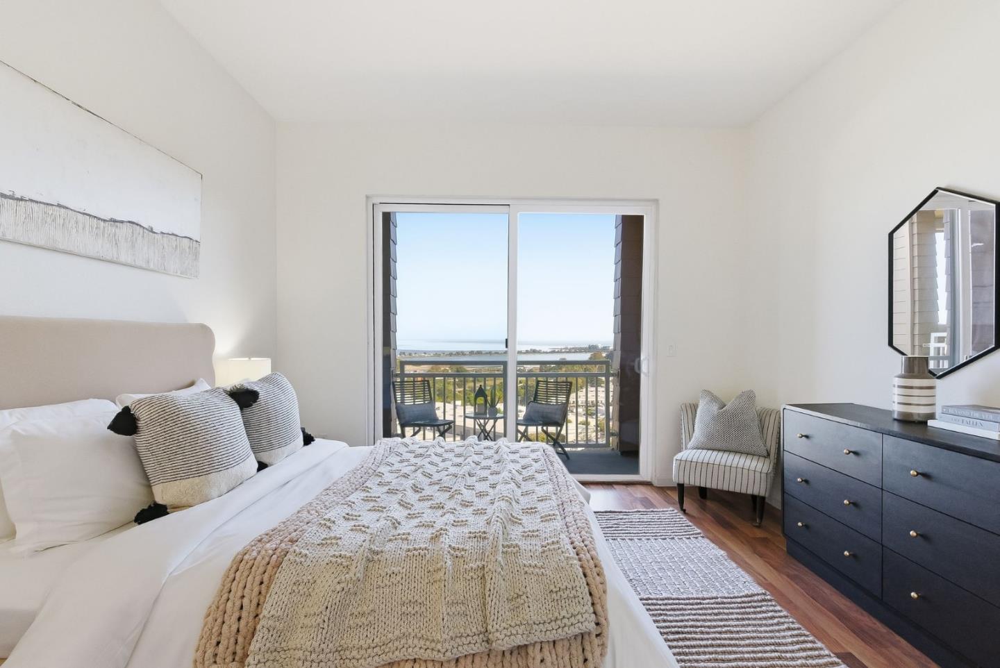 121 Cliff Swallow Court Brisbane, CA 94005 - Photo 22 of 50 a bedroom with a large bed and a window
