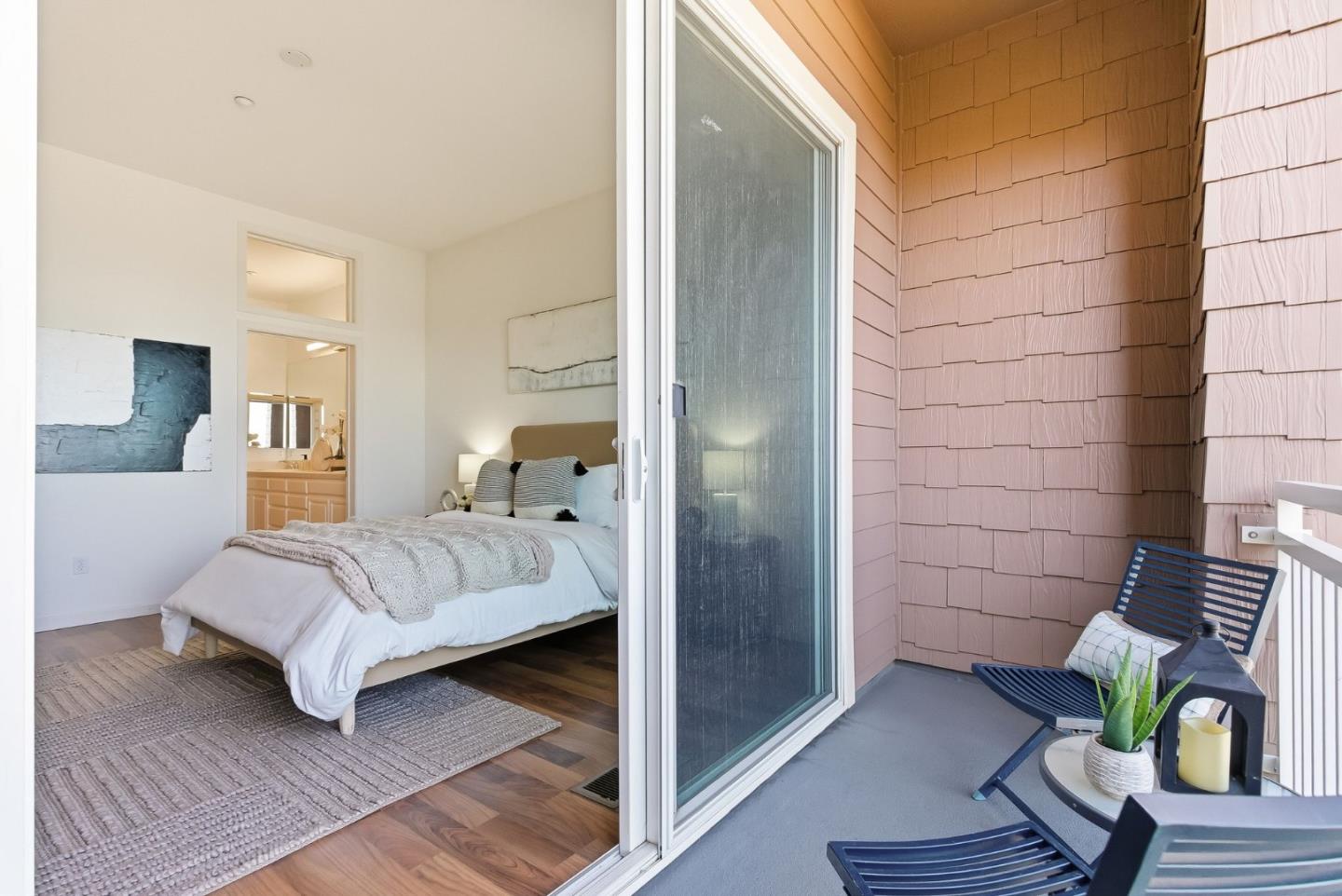 121 Cliff Swallow Court Brisbane, CA 94005 - Photo 25 of 50 a bedroom with a bed and a mirror