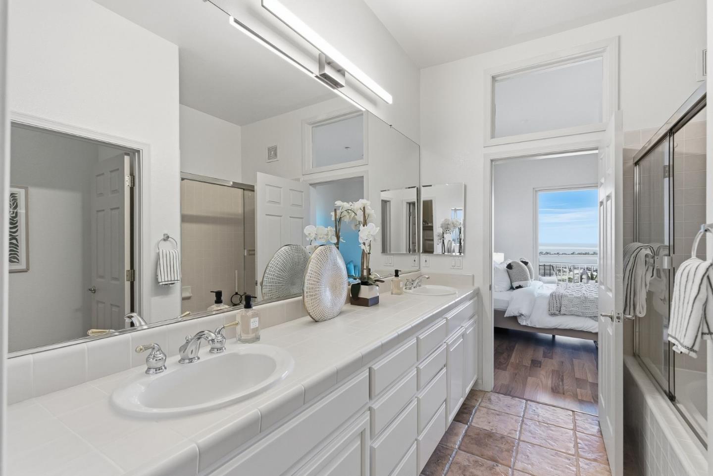 121 Cliff Swallow Court Brisbane, CA 94005 - Photo 26 of 50 a en suite bathroom with double vanity and a mirror