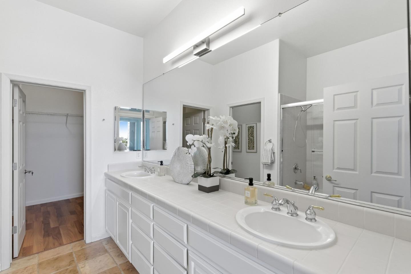 121 Cliff Swallow Court Brisbane, CA 94005 - Photo 27 of 50 a bathroom with double vanity sinks and a mirror