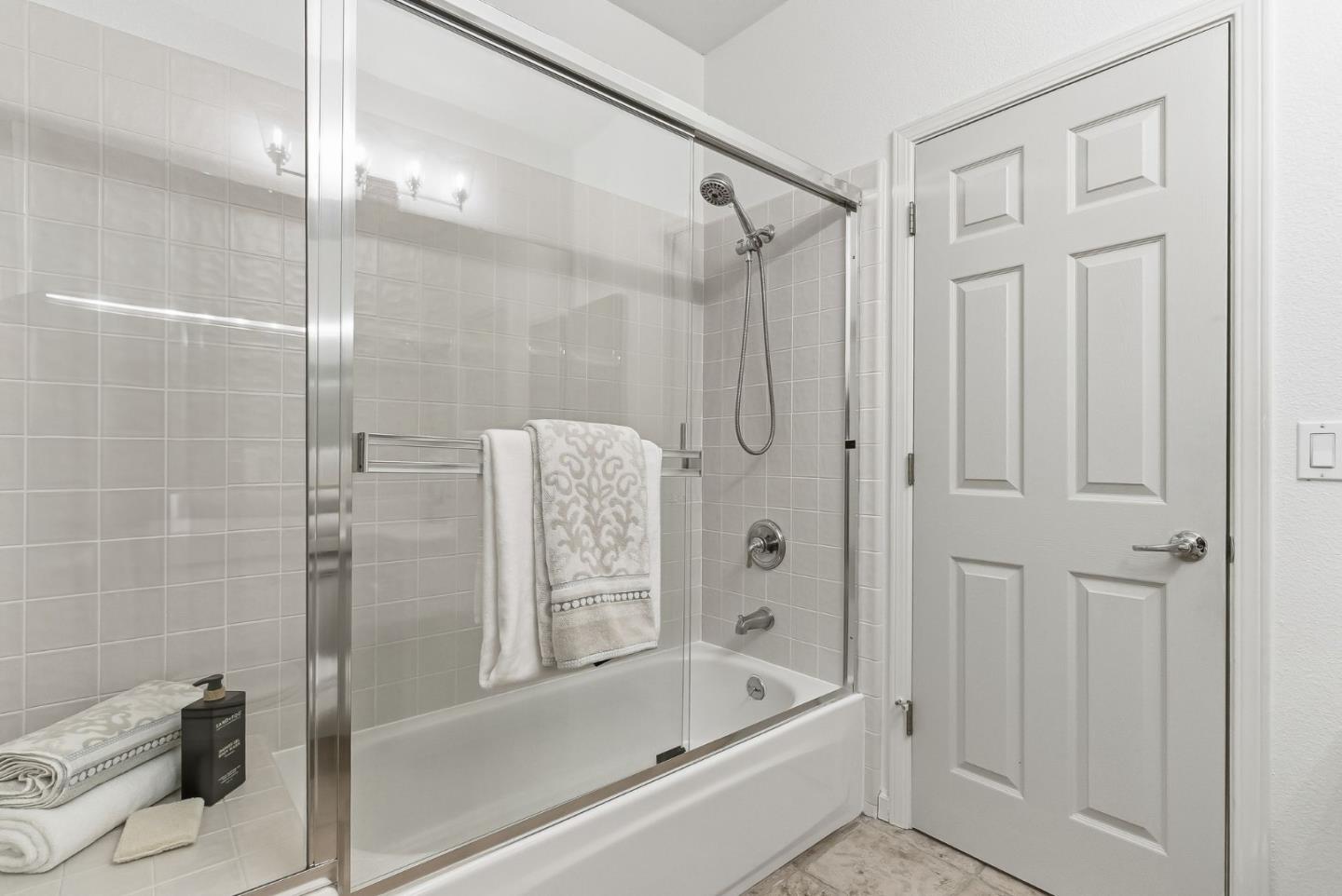 121 Cliff Swallow Court Brisbane, CA 94005 - Photo 35 of 50 a bathroom with a bathtub and a shower