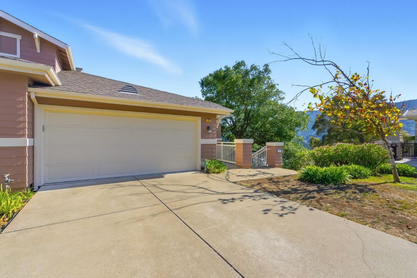 121 Cliff Swallow Court Brisbane, CA 94005 - Photo 45 of 50 a backyard of a house with plants and outdoor seating