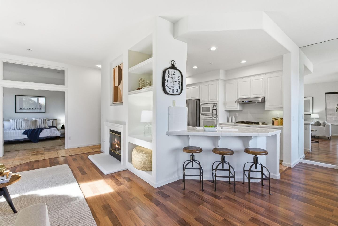 121 Cliff Swallow Court Brisbane, CA 94005 - Photo 9 of 50 a kitchen with a table chairs refrigerator and cabinets