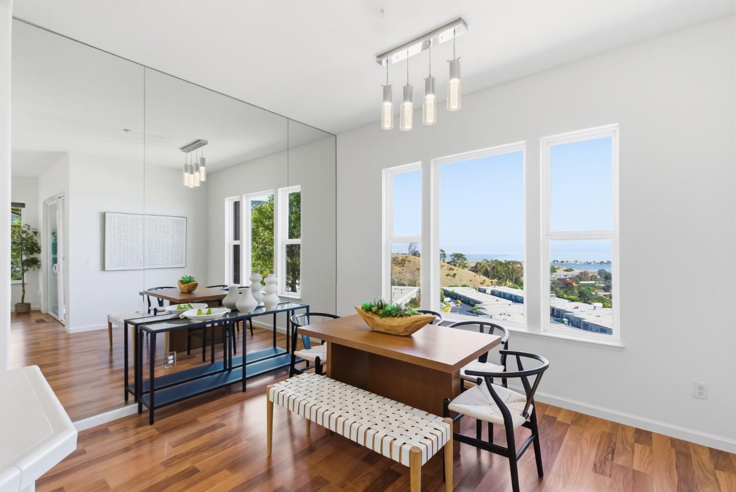 121 Cliff Swallow Court Brisbane, CA 94005 - Photo 10 of 50 a living room with furniture and a wooden floor