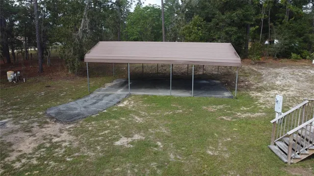 swimming pool view with a seating space