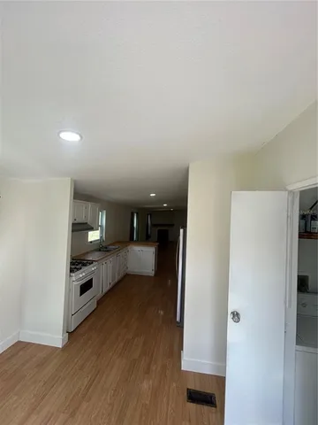 a kitchen with a refrigerator and a sink