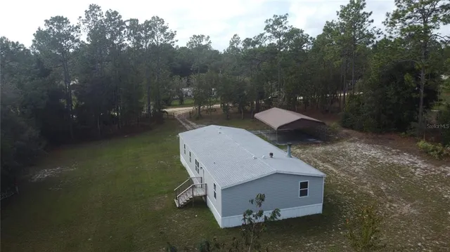 a view of a tiny house with backyard