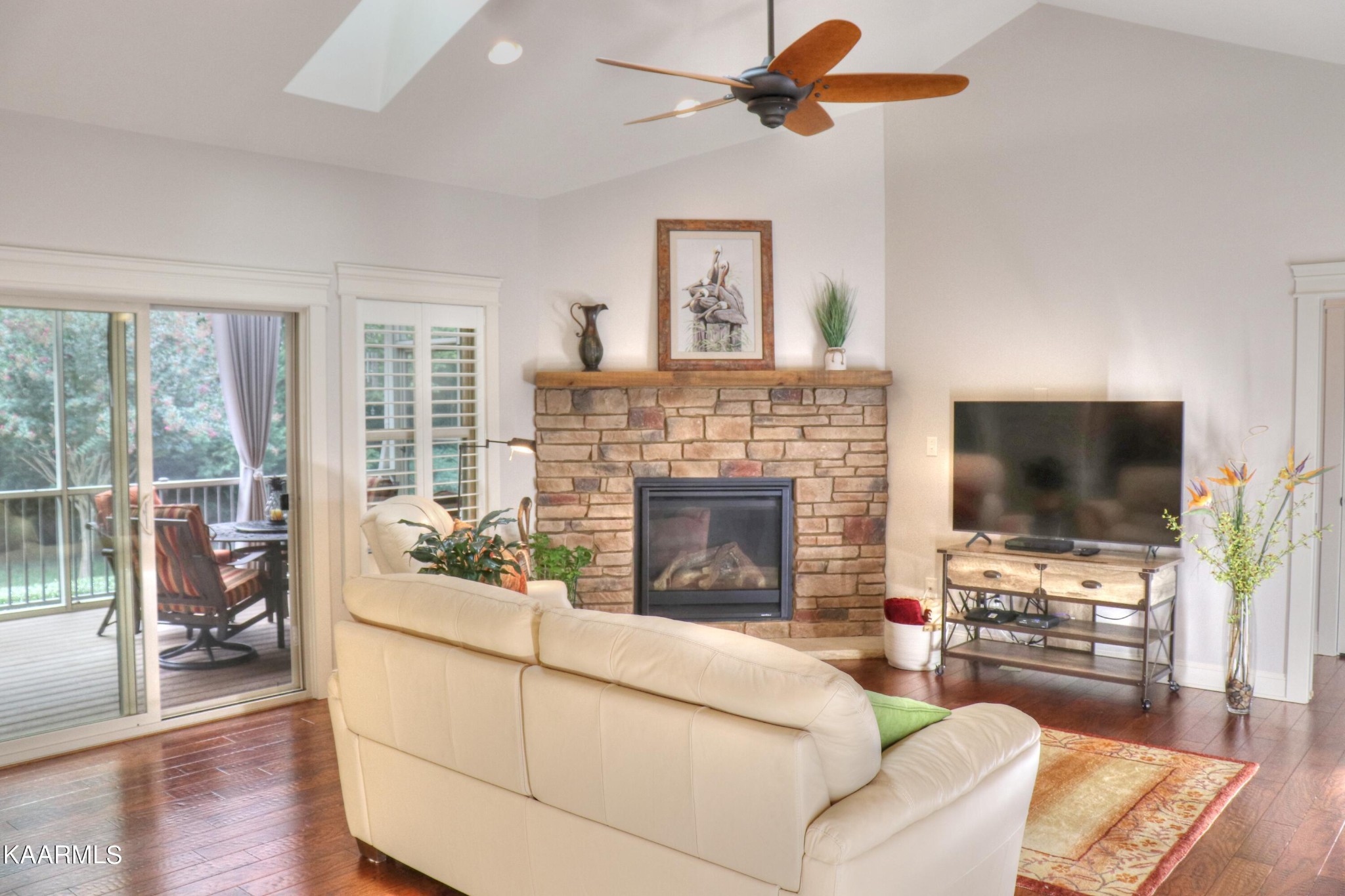 418 Cheeyo Place Loudon, TN 37774 - Photo 14 of 33 a living room with furniture a flat screen tv and a fireplace