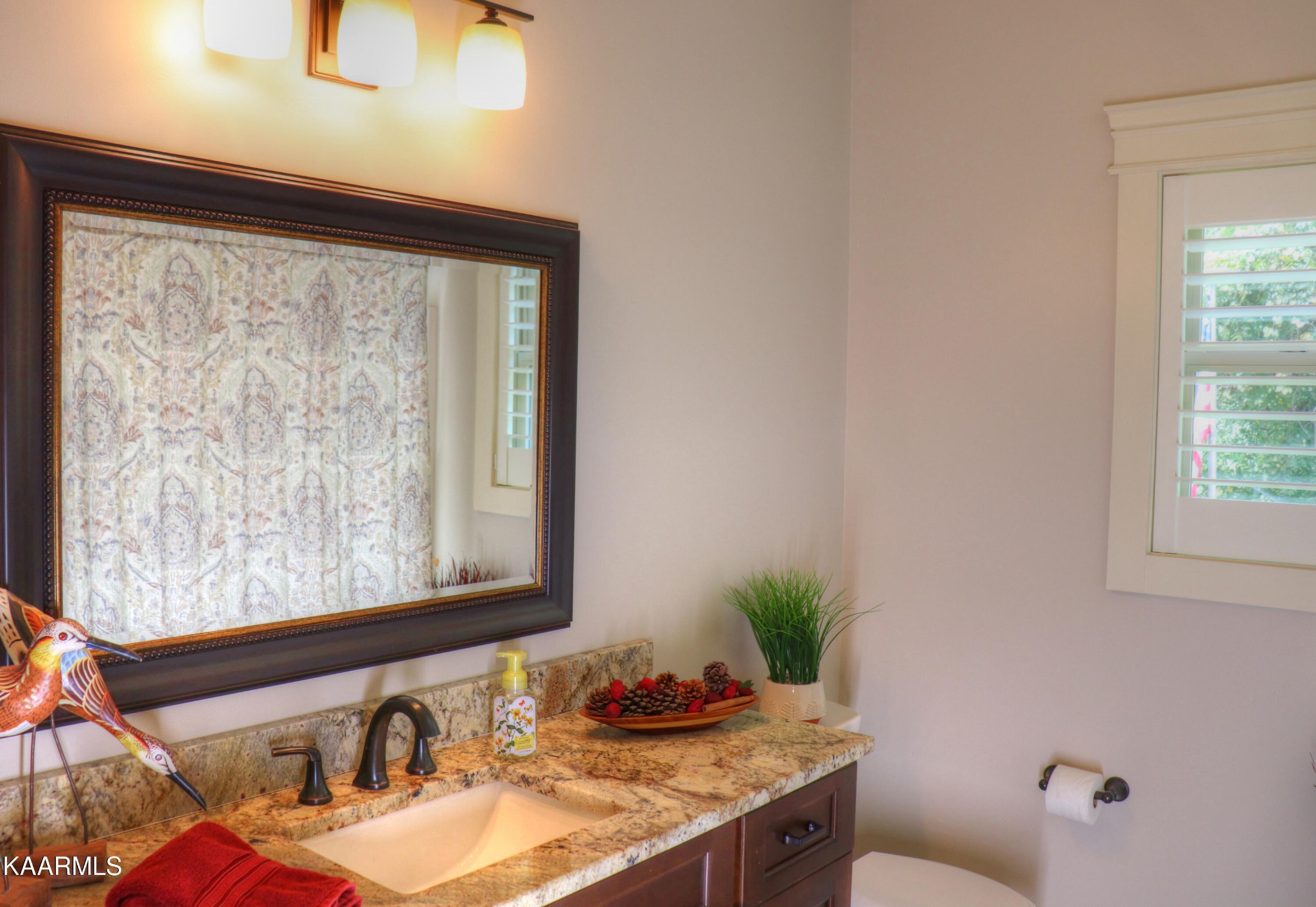 418 Cheeyo Place Loudon, TN 37774 - Photo 25 of 33 a bathroom with a granite countertop sink and a mirror