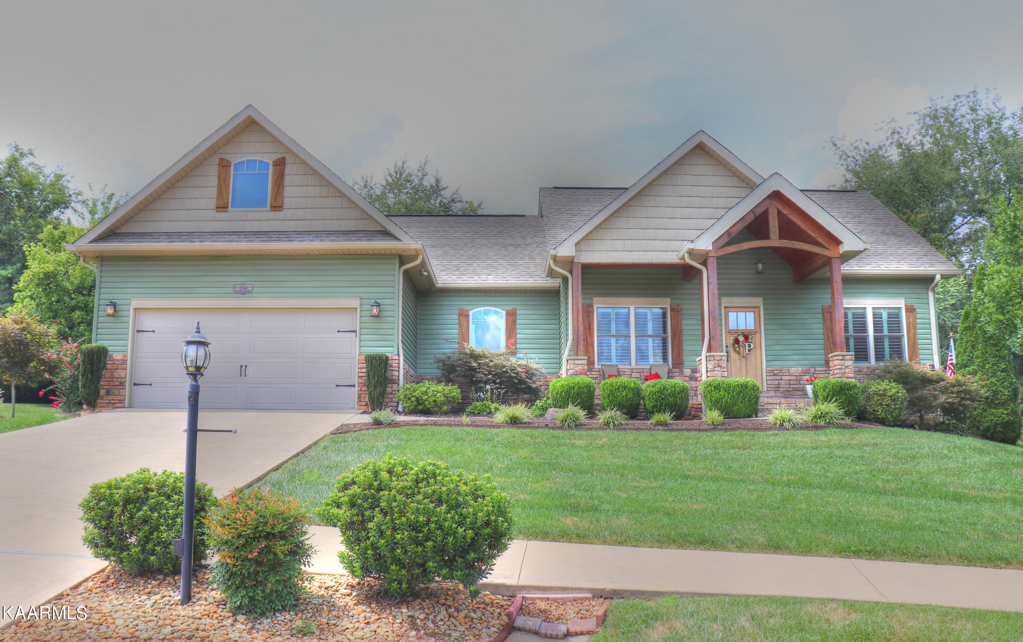 418 Cheeyo Place Loudon, TN 37774 - Photo 31 of 33 a front view of a house with a yard and garage