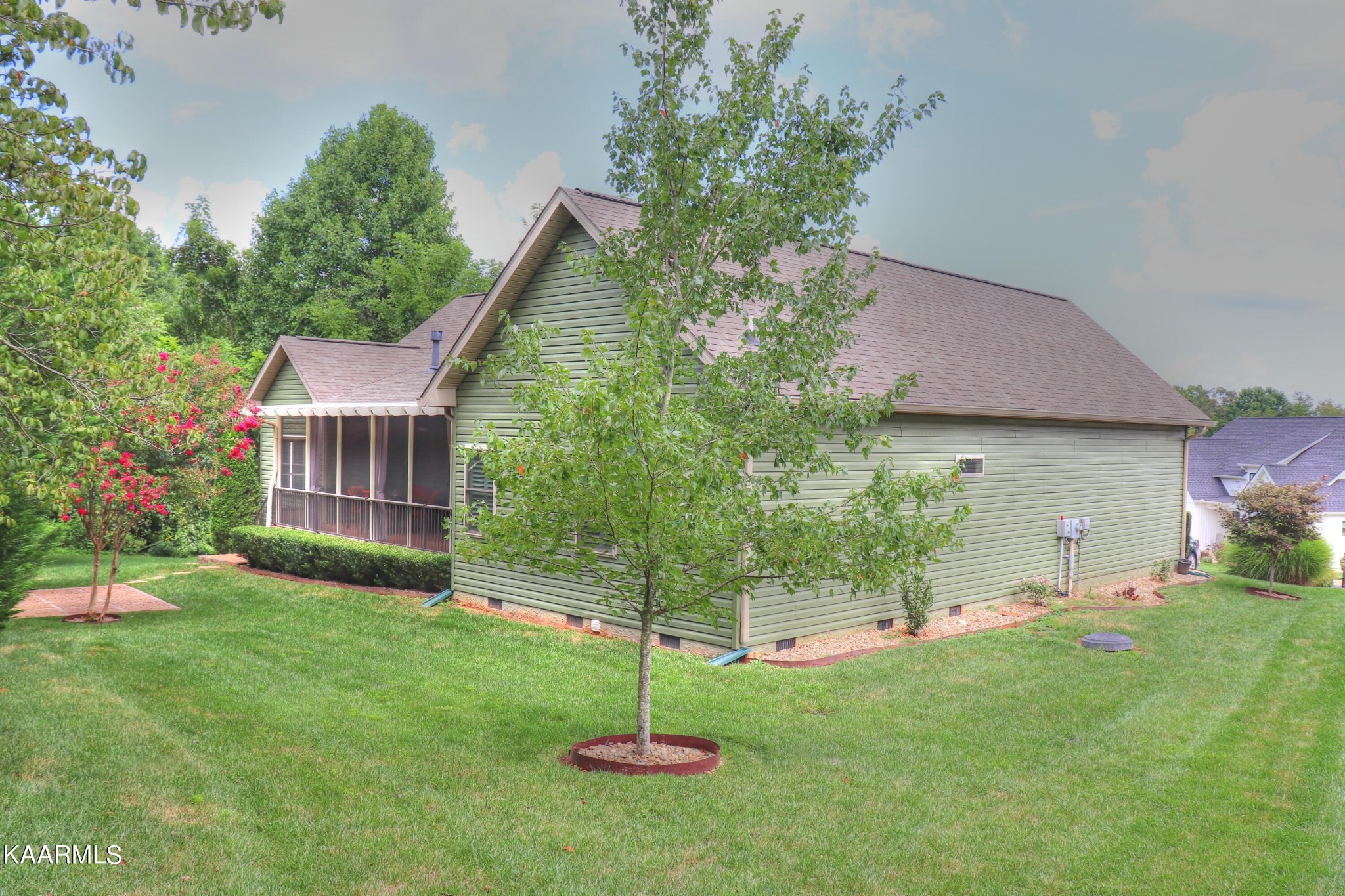 418 Cheeyo Place Loudon, TN 37774 - Photo 8 of 33 a backyard of a house with plants and a garden
