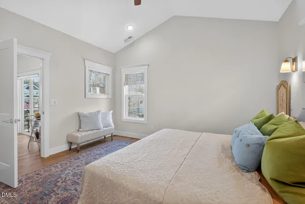 a bedroom with a bed and a couch