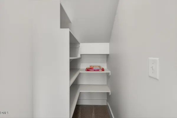 a kitchen with stainless steel appliances a refrigerator and a stove top oven