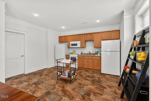 a bedroom with a bed chair and a window