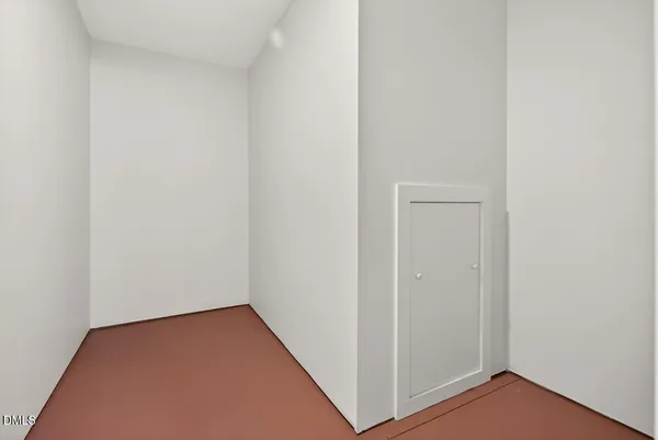 a view of a garden with a bench in front of house