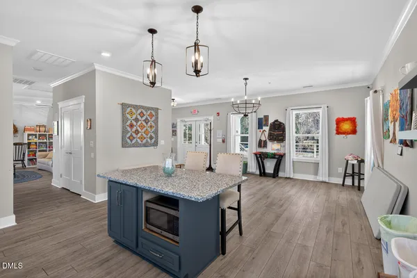 a view of a lake with a table and chairs